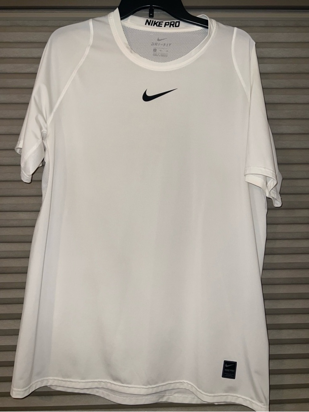 Nike White Short Sleeve Dri-FIT Tee with Black Swoosh